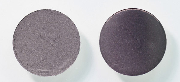 Two finished, pressed SiBoost electrode pellets side by side